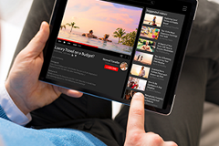 videos photo of a person watching a YouTube video on a tablet